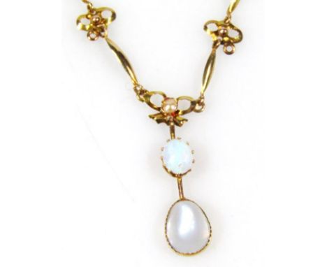 An opal style drop pendant, in the Art Nouveau manner on a fancy link chain, the pendant 3cm high.