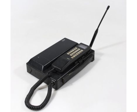 A Vintage MEC mobile hand phone with heavy receiver and battery pack with ariel 26cm wide 