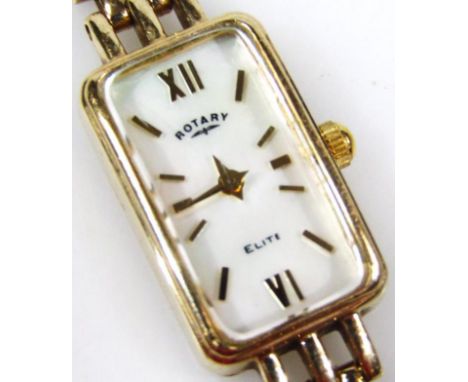 A 9ct gold ladies rotary cocktail watch, the oblong 0.5cm wide face with baton numerals and pointers and Roman numeric twelve