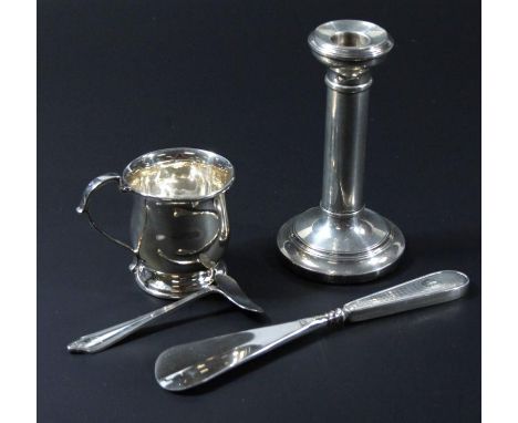 An Elizabeth II silver christening mug, with bulbous outline with angular handle on circular foot, Birmingham 1882, 7cm high,