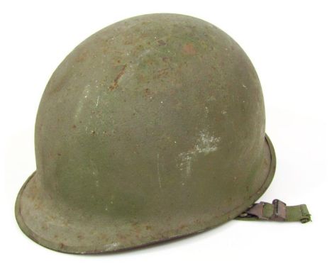An early 20thC tin war helmet, in green, with inner material webbing, partially numbered R 398, 20cm high.