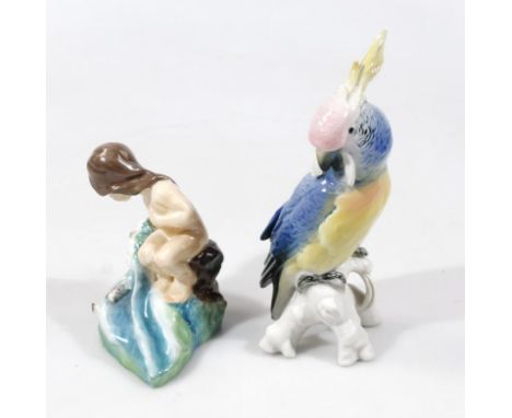 A Royal Worcester doughty figure August, printed marks beneath, Continental figure group of a cockatiel 20cm high (2)