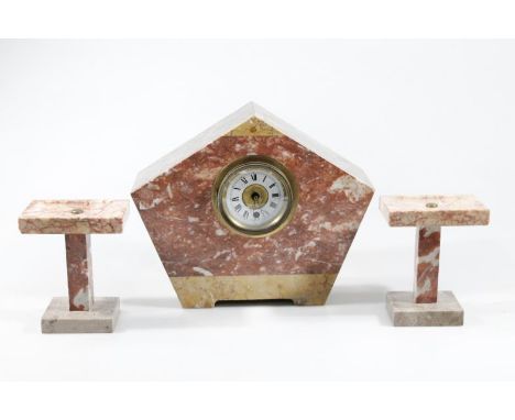 An Art Deco style pink and white marble finish mantel clock garniture set, comprising of a shaped clock with 8cm dia. Roman n