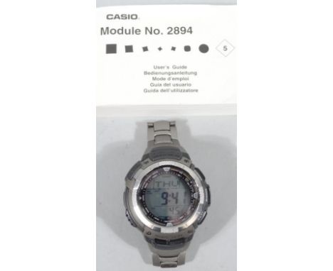 A gentleman's Casio 2894 triple sensor digital wristwatch, with 23cm dia. dial, with outer pouch and paperwork.