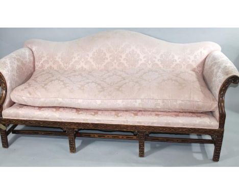 A 19thC mahogany framed scroll back settee, with Chinese Chippendale influence in (later) floral and scroll peach material, w