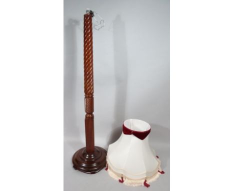 A late 19thC mahogany lamp standard, with heavy turned stem on square block column, terminating a compressed stepped circular