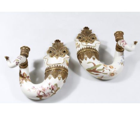 A pair of Royal Worcester twisted cornucopia ivory wall vases, with candle holders, with a raised band of decoration and moul