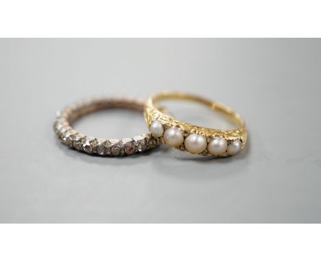 A 19th century yellow metal and rose diamond set full eternity ring, size L/M and an early 20th century yellow metal and grad