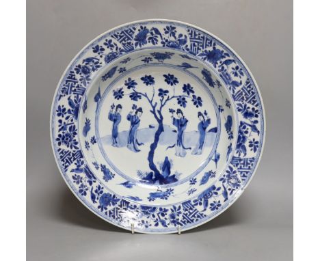 A Chinese blue and white ‘ladies’ basin, Kangxi period, cracked 34cm
