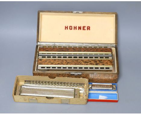 Three cased Hohner harmonicas including a chronomatica no.265