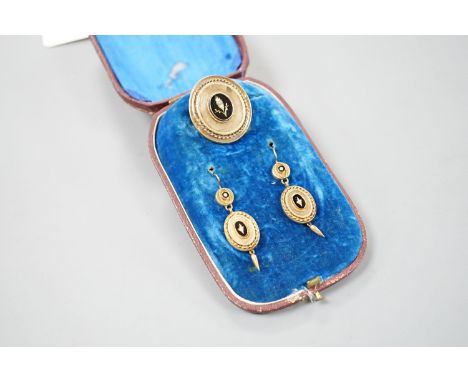 A cased Victorian yellow metal, black enamel and seed pearl set brooch, 35mm and matching pair of drop earrings, gross 13.6 g