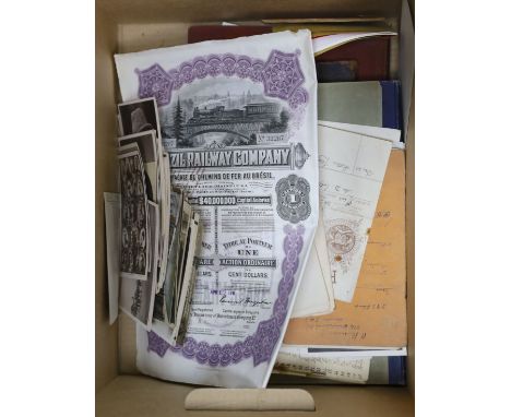 Assorted ephemera, stamps, postcard portraits of royalty, books of political cartoons, share certificates