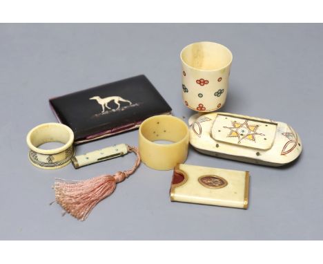 A George III ivory needle case, 6cm. a Victorian card purse inlaid with a whippet, 9.5cm, a horn snuff box and four other ite