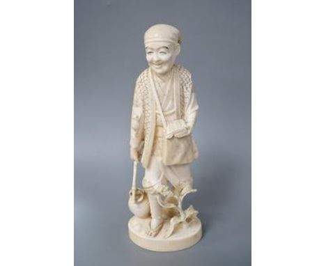 A Japanese carved ivory figure of a farmer, Meiji period, c.1900, signed, carrying a lantern on a stick, maize grows at his f