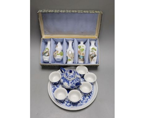 A Chinese blue and white miniature teapot, 6 matching cups and a tray and a box of five vases