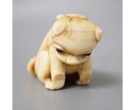 A 19th century Japanese carved ivory ‘dog’ netsuke 3cm tall