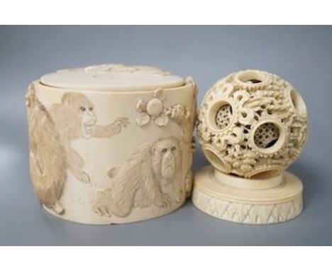 A late 19th century Chinese carved ivory concentric ball comprising seven reticulated spheres, with a small stand, and a Japa