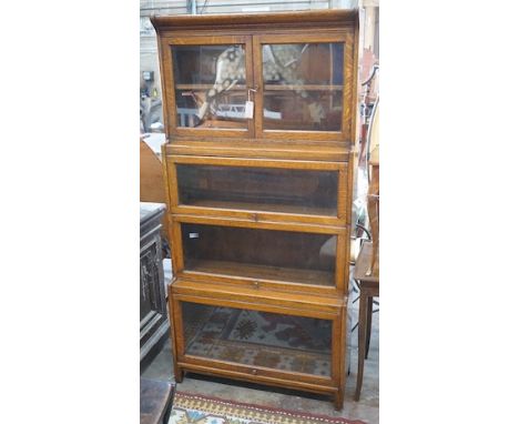 An early 20th century Globe Wernicke style oak four section glazed bookcase, width 87cm, depth 32cm, height 179cm