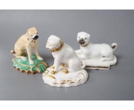 A Derby pug dog with white and gilt decoration, another pug dog perhaps Rockingham and an English porcelain pug dog, first ha