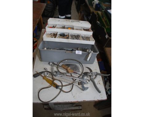 A plastic tool box with various spanners, etc.