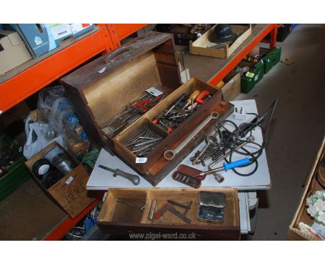 A wooden tool box with good selection of central and pin punches, spanners, etc.
