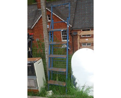 A five rung metal step ladder, two stage.