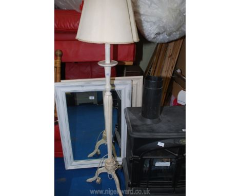 A cream Standard lamp on tripod legs including shade.