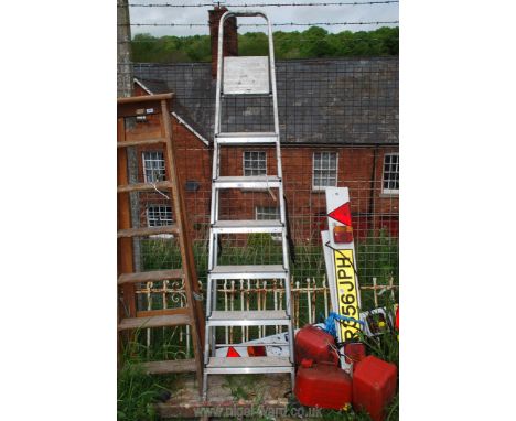 A seven rung aluminium step ladder.