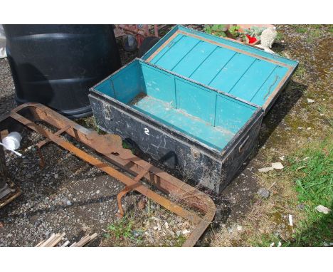 A metal trunk and a kerb.