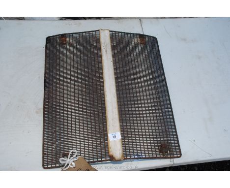 A tractor front grill, 17 1/2" wide x 19" high.