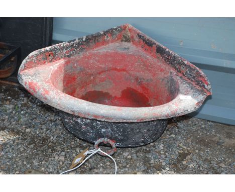 A metal corner water trough 