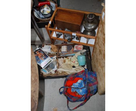 A box of knitting equipment, dolls cot, roller skates, oil lamp etc