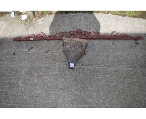 A cast down pipe hopper with an ornate cast iron wall/ gate top 58" wide. 