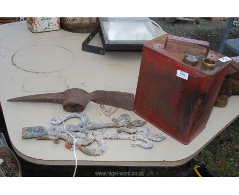 A petrol fuel can with brass top, flat iron scroll features and pick axe head.