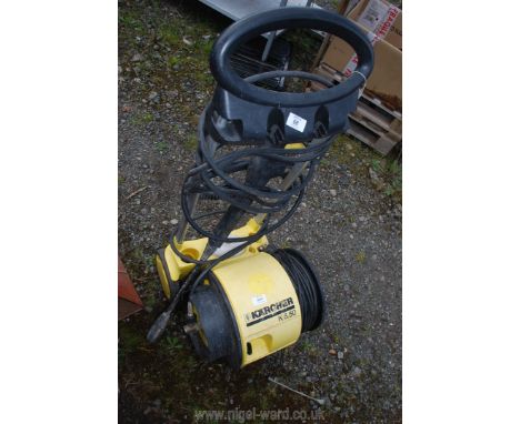 A K'archer pressure washer, K.50 model. (Motor ran at time of testing, pumping action not tested).