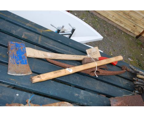 An axe, sledge hammer handle, lot splitter head and pick axe head.