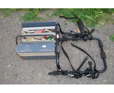 A cantilever tool box and contents and a car mounted bicycle rack.