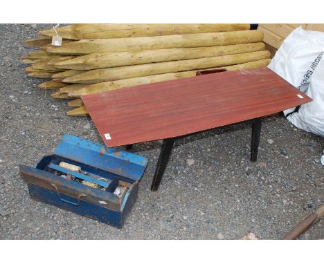 A coffee table and a tool box.