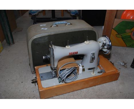A cased Jones electric sewing machine, model D66. (Ran at time of testing).