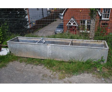 A field water trough, 8' long x 19'', a/f.