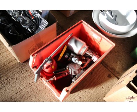 A plastic crate containing various spray guns; air ratchet; other air tools etc