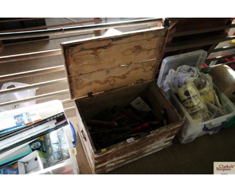 A wooden toolbox with a quantity of various vintage hand tools