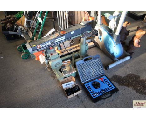 A Dewalt Power shop DW125 radial arm saw with instruction manual and accessories 