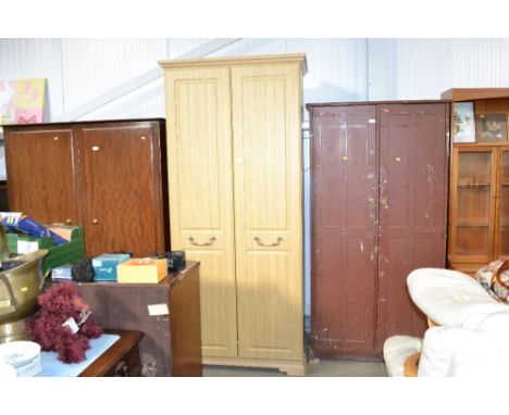 A modern light oak effect two door wardrobe