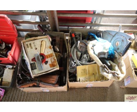 Two boxes containing various tools to include; chain, drill pouch, set of calipers, hand brace, hammers, planes etc.