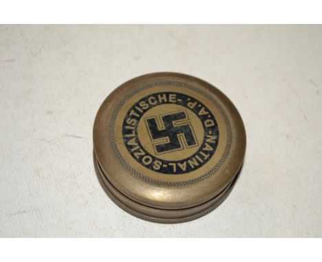 A reproduction brass compass (69)