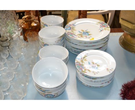 A collection of R W Essentials "Blue Rose" patterned dinnerware