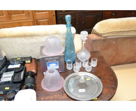 A collection of glassware including decanters; light shades and a silver plated tray