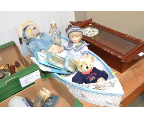 A wall shelf in the form a boat; various seaside related items including picture frames; dolls etc