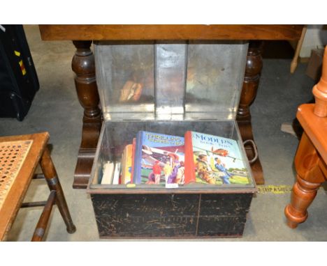A metal trunk and contents of children's books